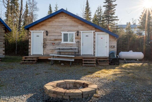 65449 Lingonberry Rd, Ninilchik, AK 99639 - back of house featuring a fire pit