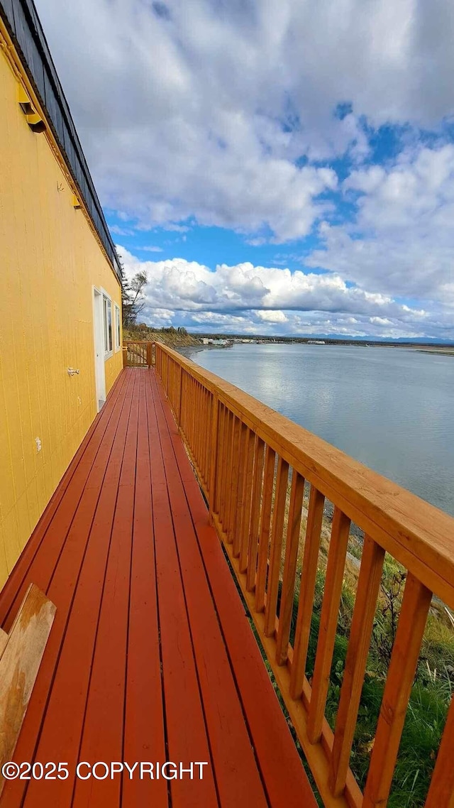 deck featuring a water view