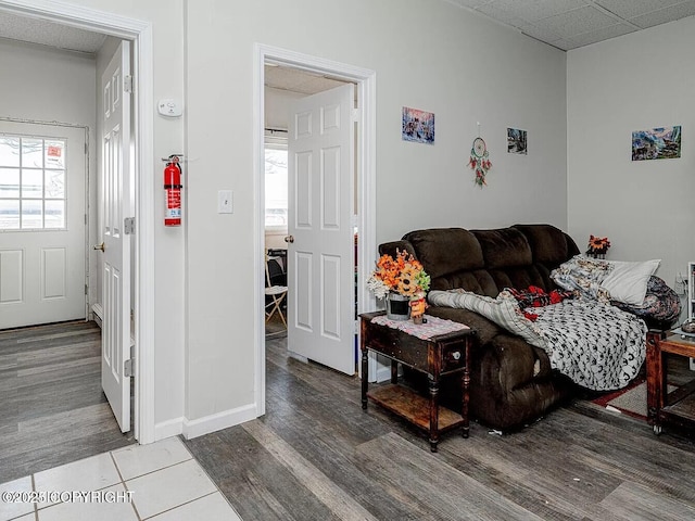 living room featuring baseboards and wood finished floors