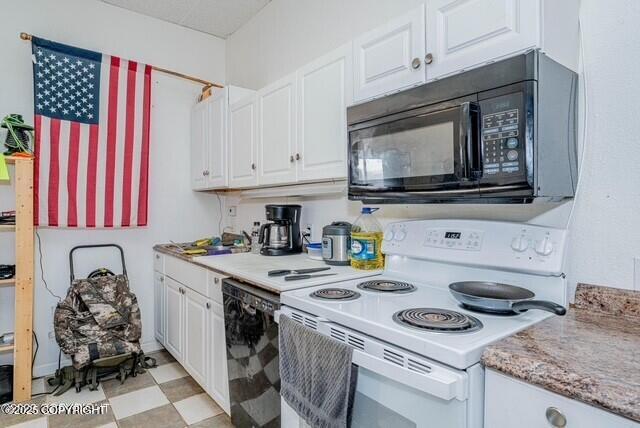 kitchen with white cabinets and black appliances