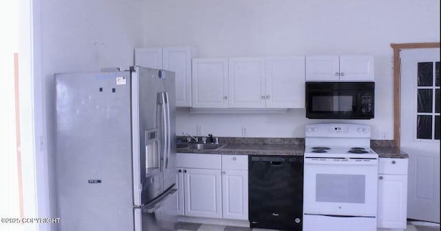 kitchen featuring a sink, white cabinets, and black appliances
