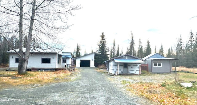 view of front facade with a garage and an outdoor structure