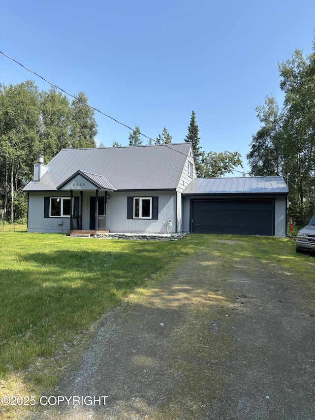 7025 S Gilleys Cir, Wasilla, AK 99654 - ranch-style house featuring dirt driveway, a front yard, an attached garage, and a metal roof