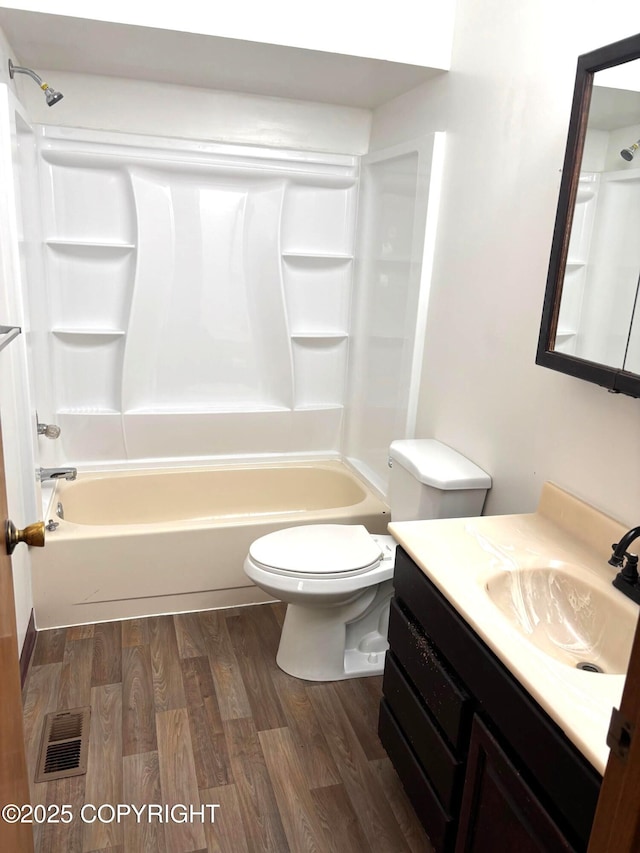 7025 S Gilleys Cir, Wasilla, AK 99654 - full bath featuring vanity, wood finished floors, and shower / bath combination