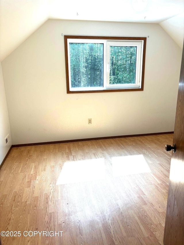 7025 S Gilleys Cir, Wasilla, AK 99654 - additional living space featuring vaulted ceiling and wood finished floors