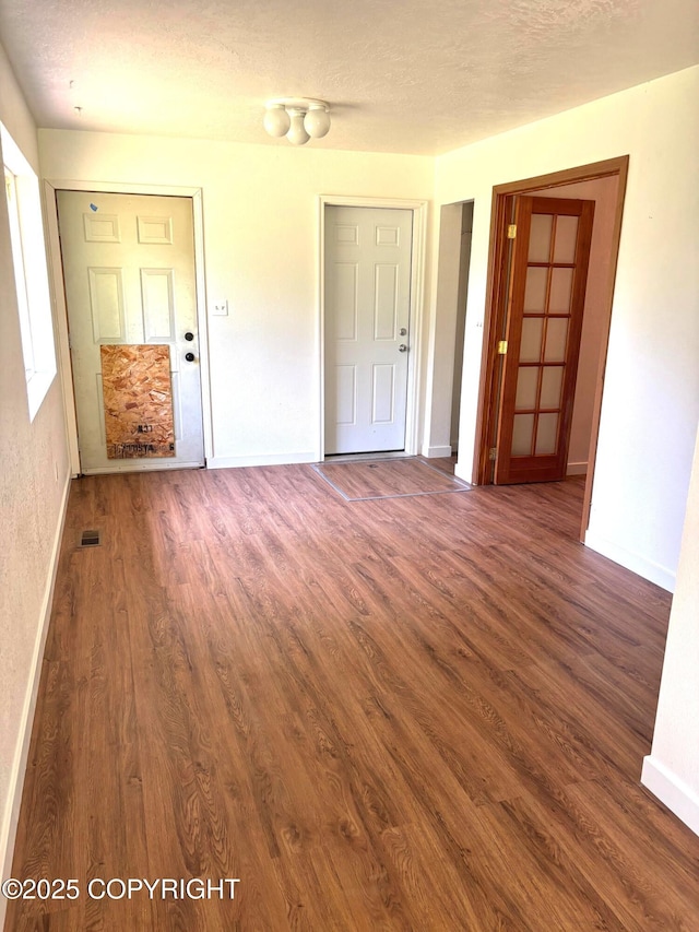 7025 S Gilleys Cir, Wasilla, AK 99654 - unfurnished room with wood finished floors and a textured ceiling