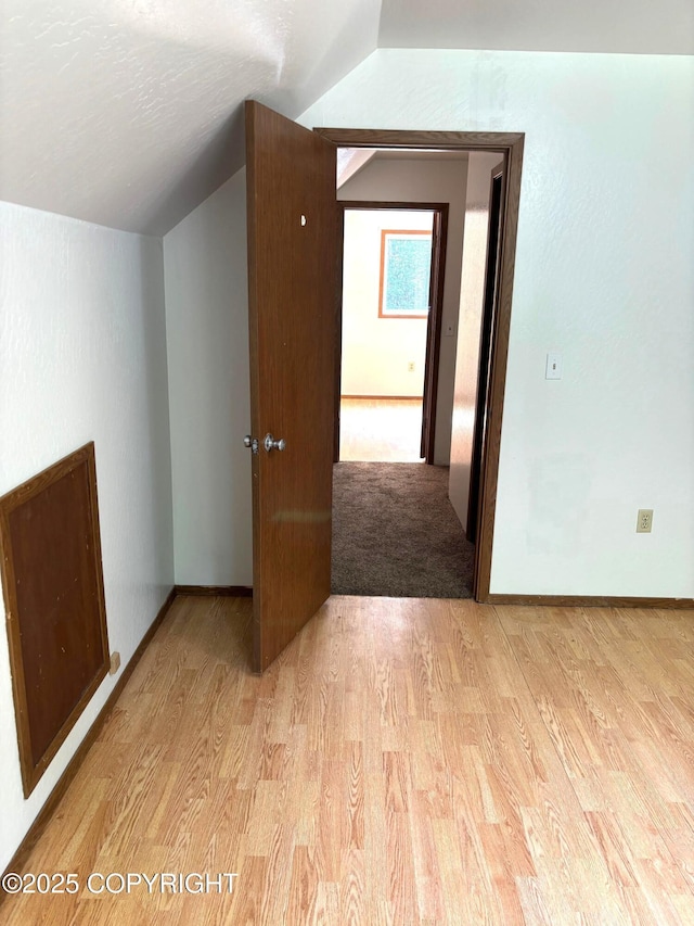 7025 S Gilleys Cir, Wasilla, AK 99654 - bonus room featuring vaulted ceiling and light wood-type flooring