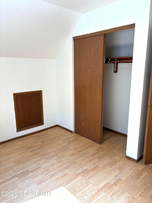 7025 S Gilleys Cir, Wasilla, AK 99654 - additional living space featuring light wood-style floors and vaulted ceiling