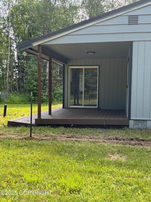 7025 S Gilleys Cir, Wasilla, AK 99654 - exterior space with a lawn and a wooden deck