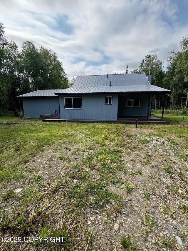 7025 S Gilleys Cir, Wasilla, AK 99654 - rear view of house with a metal roof