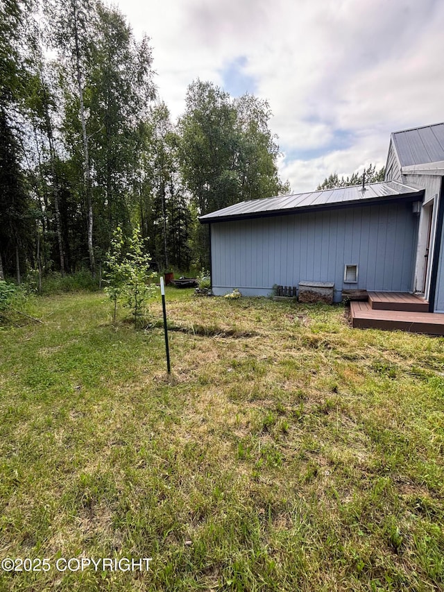 7025 S Gilleys Cir, Wasilla, AK 99654 - view of green lawn featuring a wooden deck