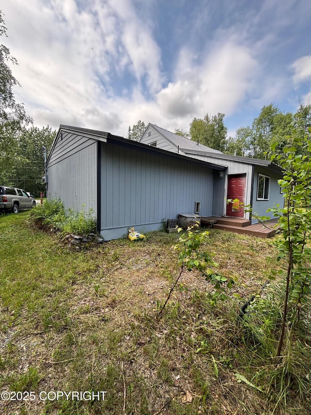 7025 S Gilleys Cir, Wasilla, AK 99654 - view of side of property featuring a wooden deck