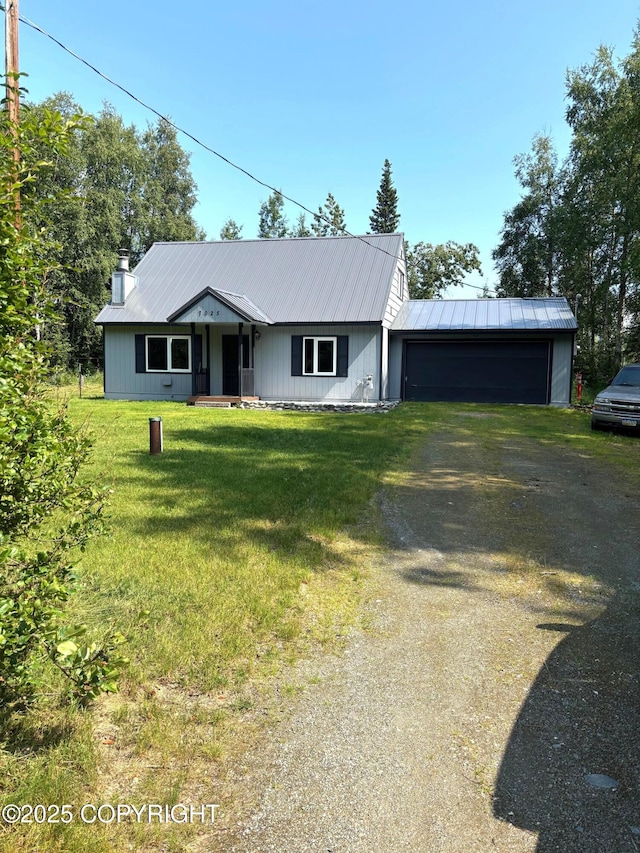 7025 S Gilleys Cir, Wasilla, AK 99654 - ranch-style home featuring driveway, an attached garage, a front yard, and a metal roof