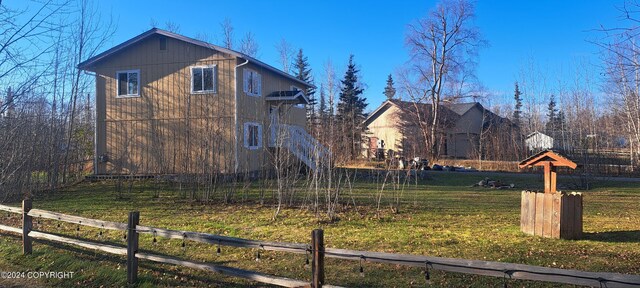 view of home's exterior featuring a lawn