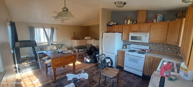 kitchen featuring lofted ceiling, decorative backsplash, ceiling fan, and white appliances