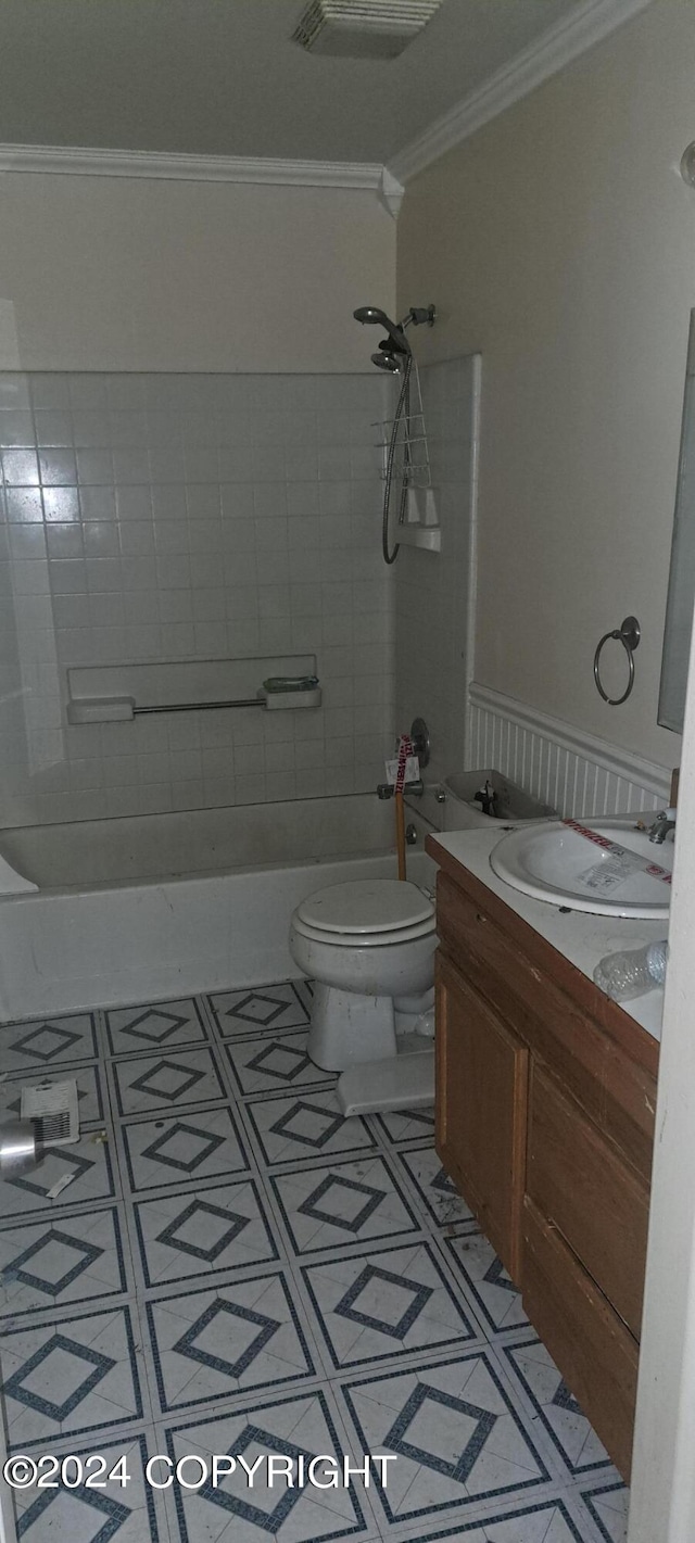 full bathroom featuring vanity, tiled shower / bath combo, toilet, and tile patterned flooring