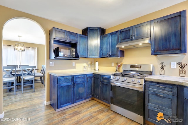 kitchen with light hardwood / wood-style floors, stainless steel gas stove, and blue cabinetry