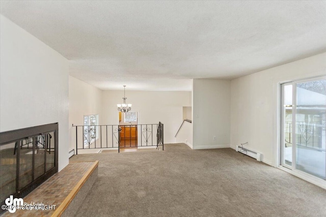 interior space featuring a textured ceiling, a baseboard radiator, and a chandelier