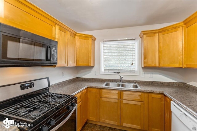 kitchen with sink, white dishwasher, and stainless steel gas range