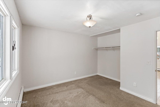 unfurnished bedroom with a closet and carpet