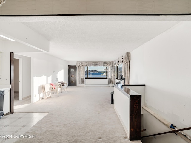 carpeted living room featuring a textured ceiling