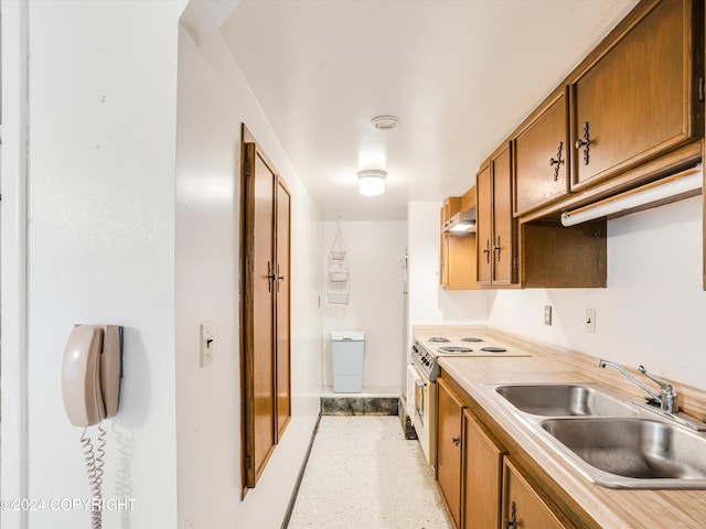 kitchen with electric stove and sink