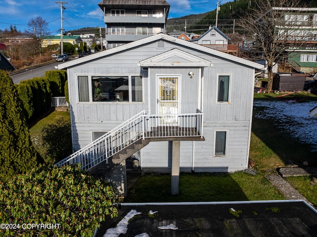 back of house with a yard