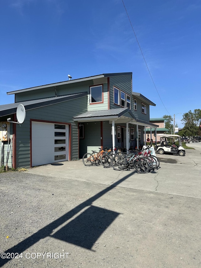 view of front facade with a porch and a garage