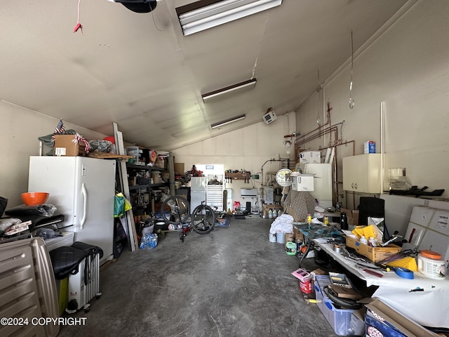 garage with white fridge