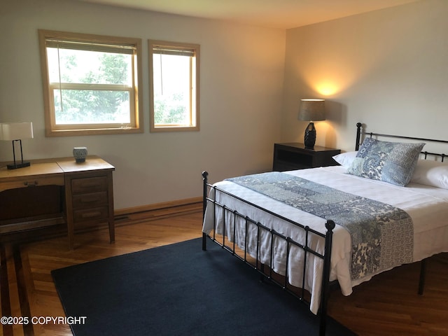 251 Main St, Seldovia, AK 99663 - bedroom with baseboards and wood finished floors