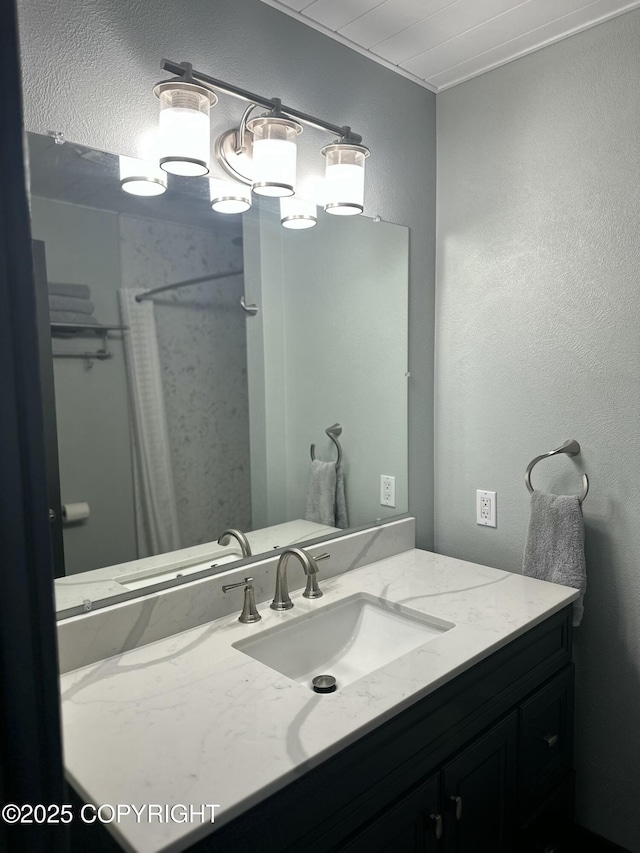 251 Main St, Seldovia, AK 99663 - bathroom with curtained shower, a textured wall, and vanity