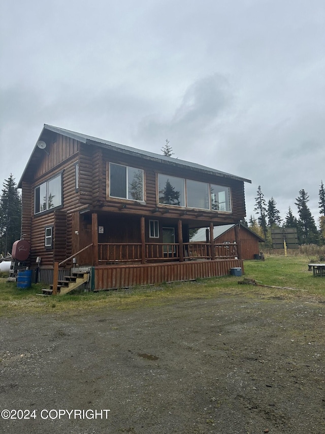 28160 Chestes St, Ninilchik, AK 99556 - chalet / cabin with board and batten siding and log veneer siding