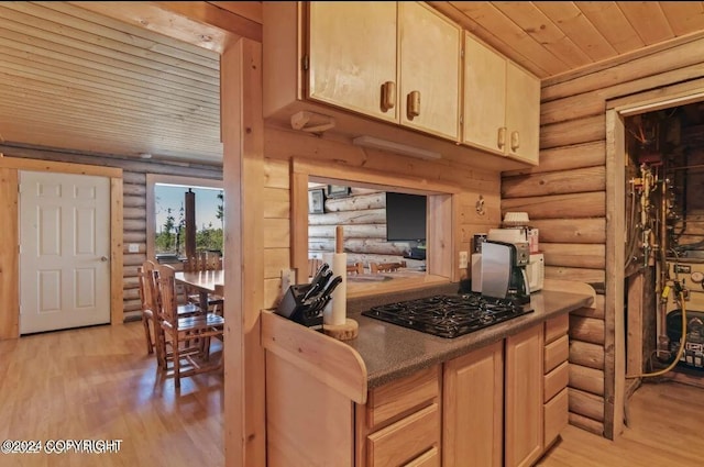 28160 Chestes St, Ninilchik, AK 99556 - kitchen featuring rustic walls, black gas cooktop, light wood finished floors, wood ceiling, and light brown cabinets