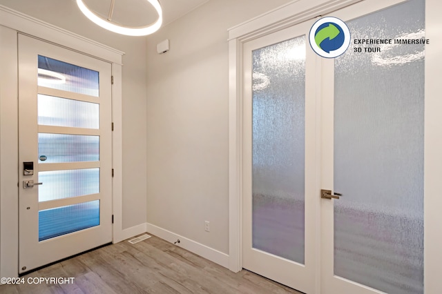 entryway with light hardwood / wood-style flooring