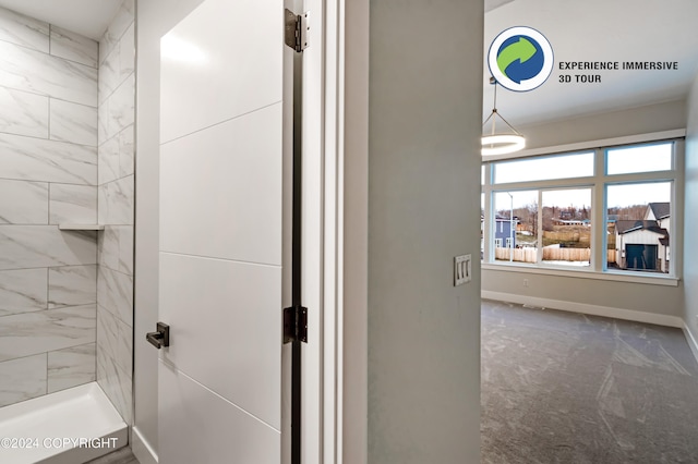 bathroom featuring tiled shower