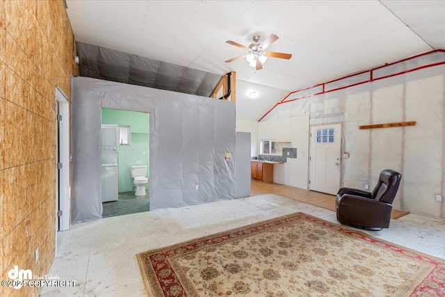 living room featuring ceiling fan and lofted ceiling