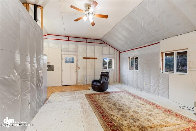 interior space with ceiling fan