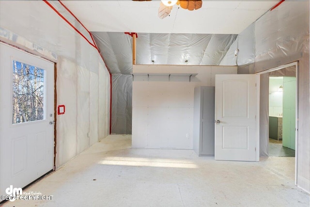 basement featuring ceiling fan