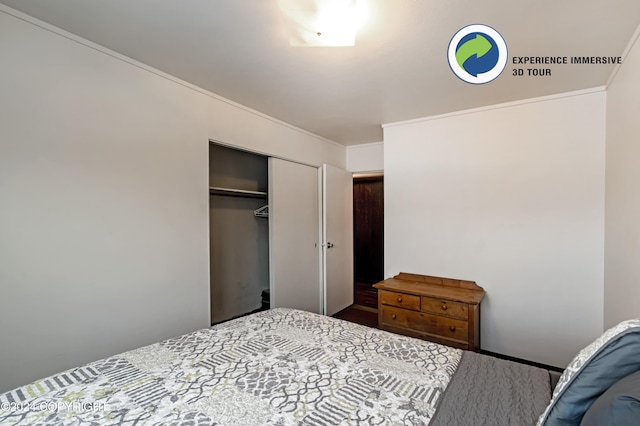 bedroom with a closet and ornamental molding