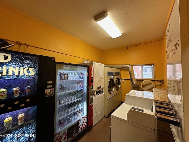 laundry room featuring stacked washer / drying machine, crown molding, a textured ceiling, and washing machine and clothes dryer