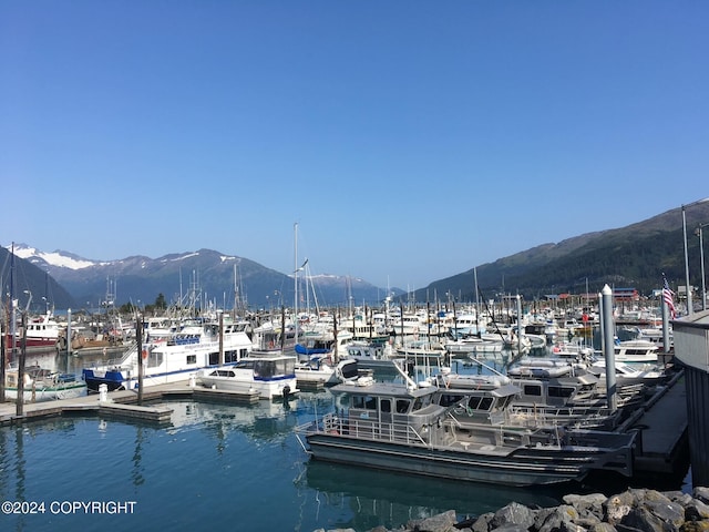 dock area featuring a water and mountain view