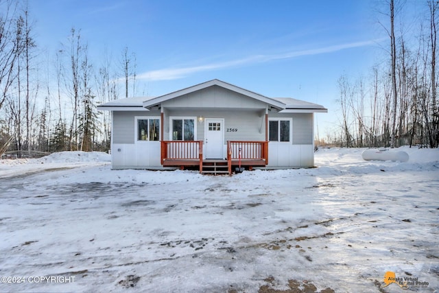 view of snow covered house