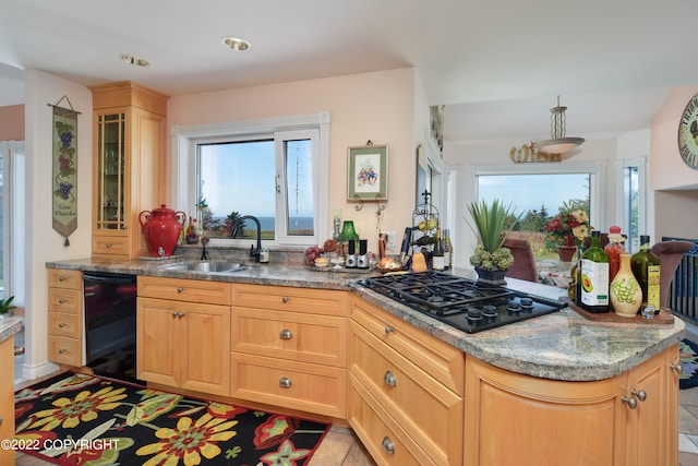 kitchen featuring light brown cabinets, sink, black appliances, light tile patterned flooring, and light stone counters