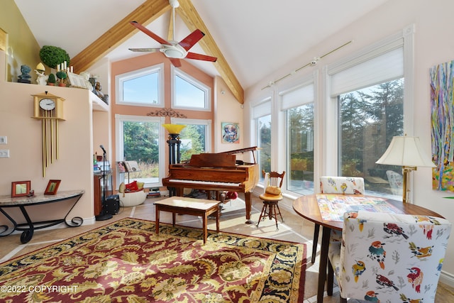 living area featuring ceiling fan, high vaulted ceiling, and beam ceiling