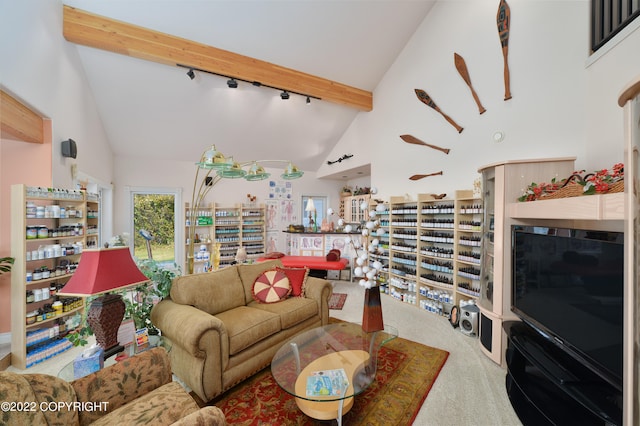 carpeted living room featuring beamed ceiling and high vaulted ceiling