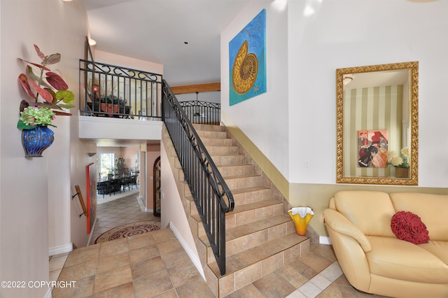 stairs featuring tile patterned flooring