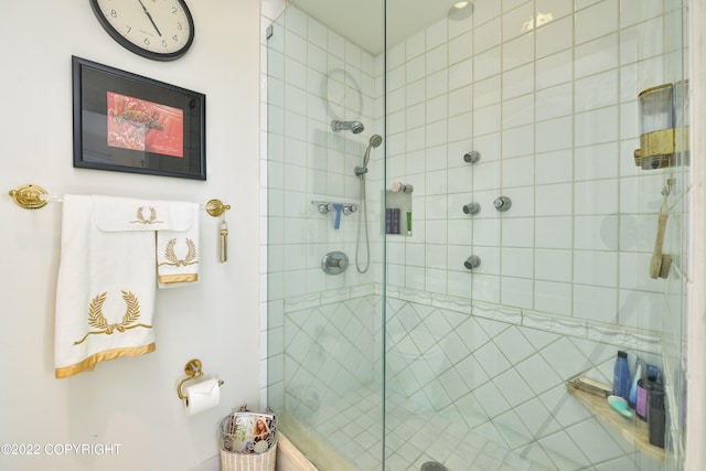 bathroom with a shower with shower door