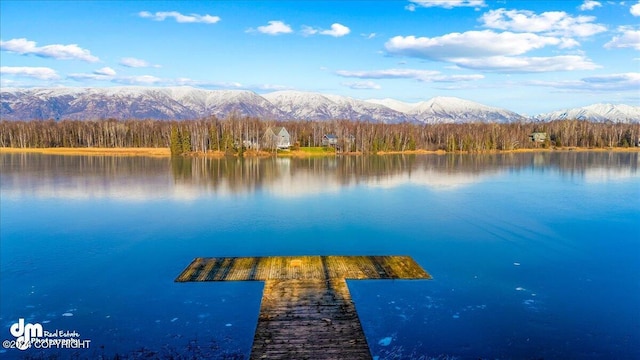 dock area featuring a water and mountain view