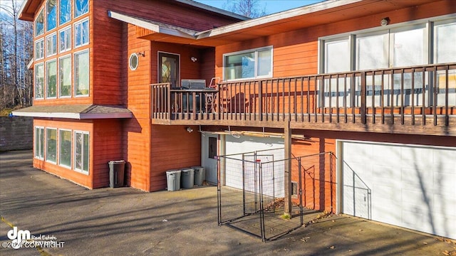 rear view of house with a garage