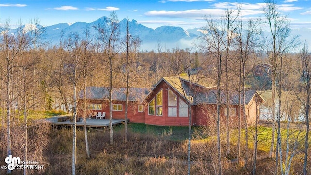 back of house with a mountain view